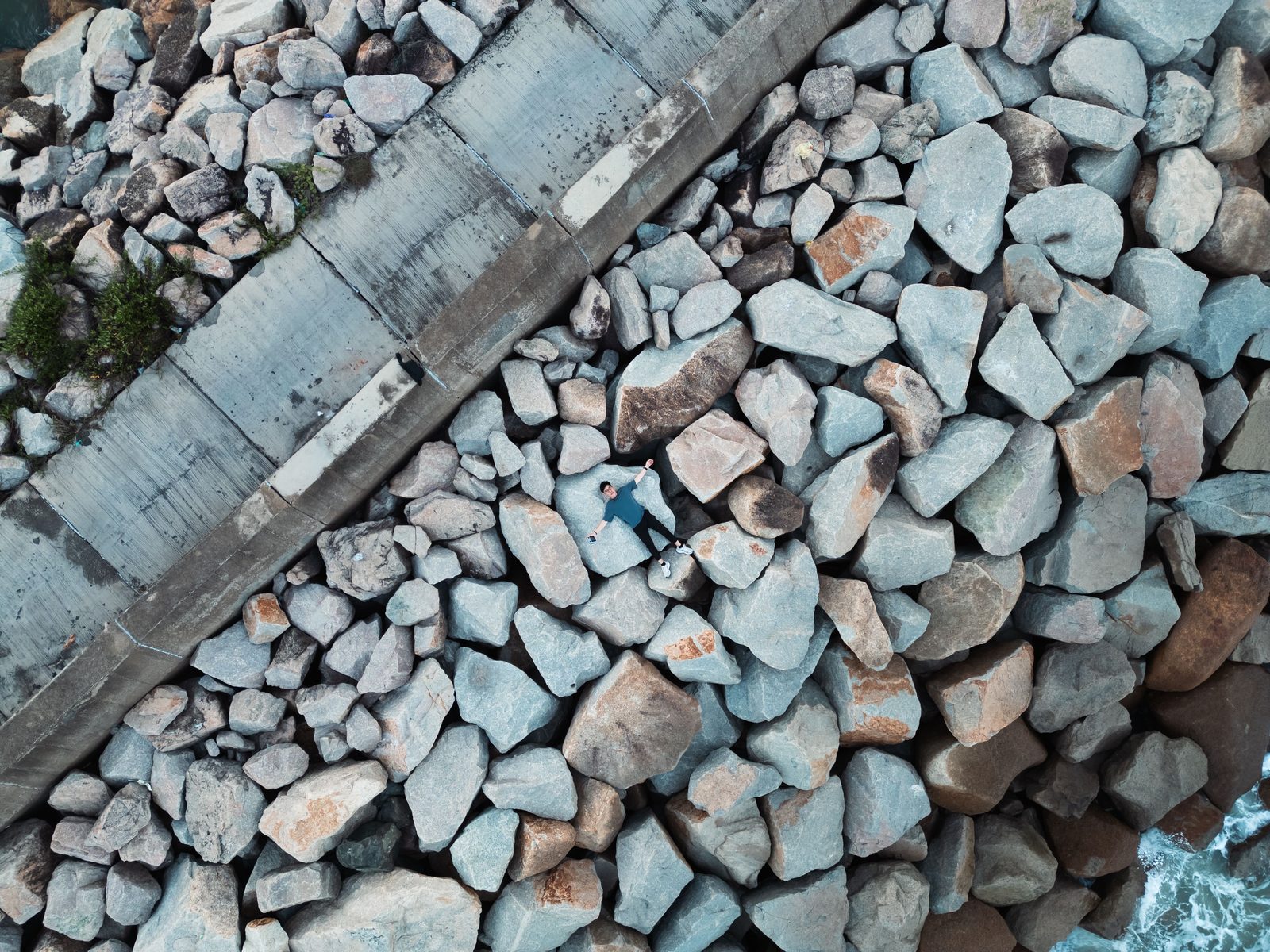 A beautifully arranged hardscape with stones and root.